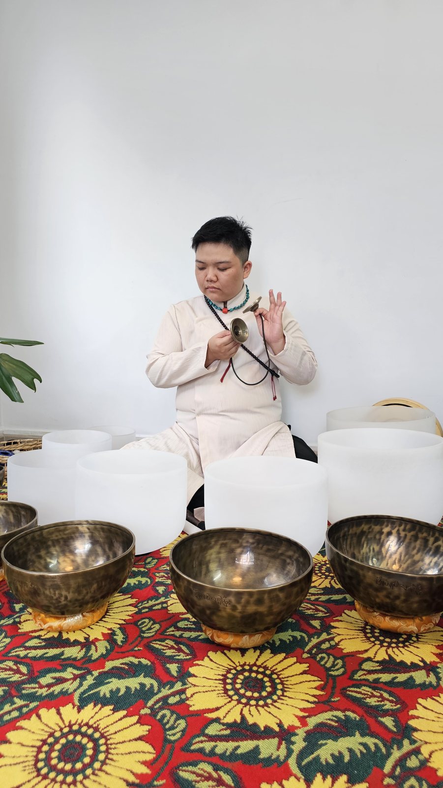 Kennedy playing chimes and singing bowls