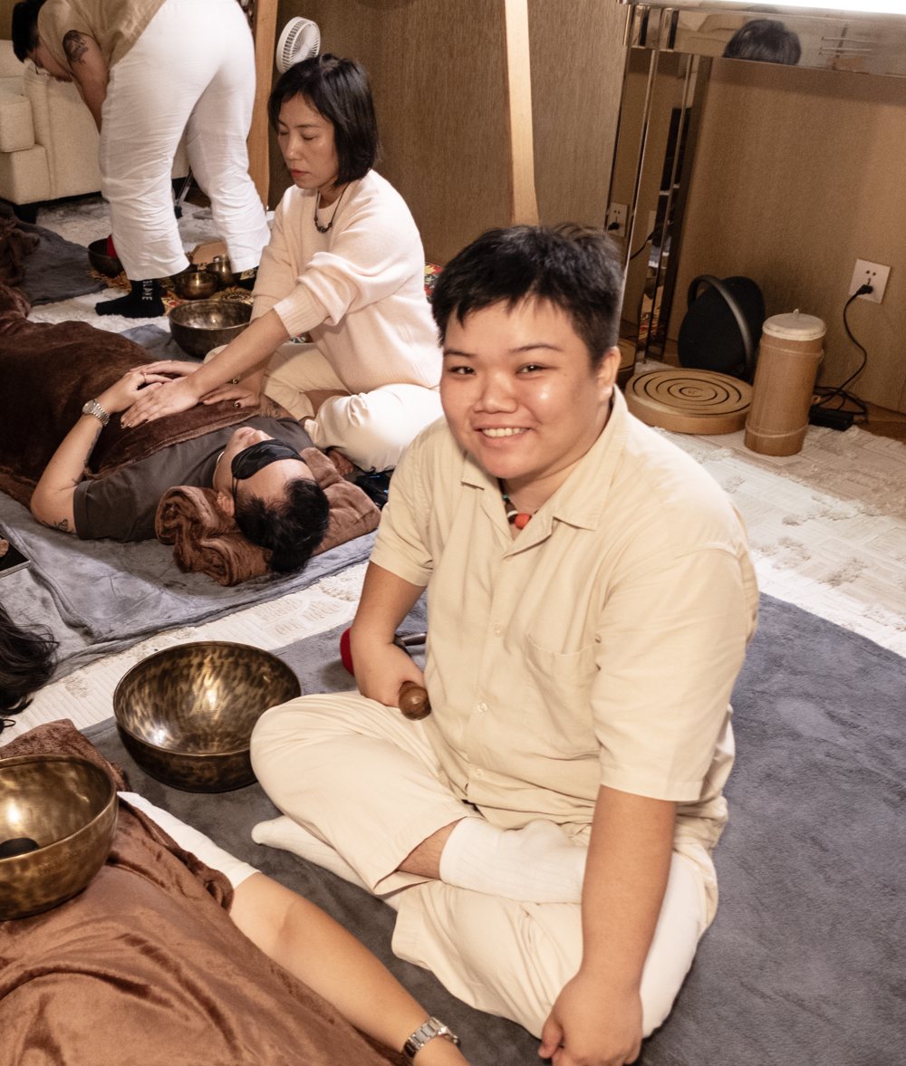 Kennedy smiling during a group sound bath